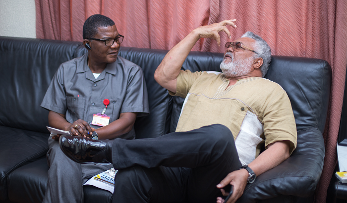 An obviously charged former President Rawlings explaining his position on the bribery issue